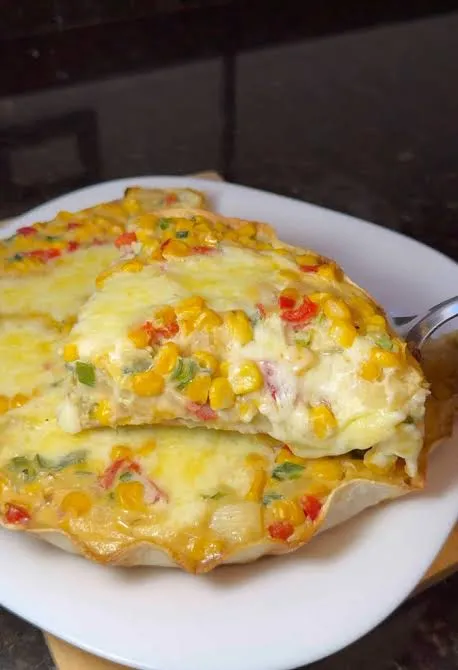Tortilla de choclo con cebolla y queso cremoso
